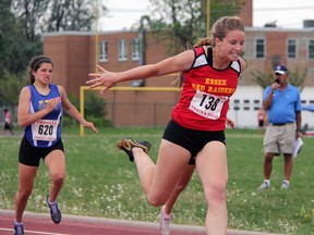 Essex sprinter Madeline McCloskey stretches for the finish line to win the junior girls 100-metre race at the SWOSSAA track and field championships Wednesday, May 22, 2013 at St. Patrick's high school in Sarnia. (PAUL OWEN/The Observer/QMI AGENCY)