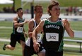 Herman's Brett Banwell, right, runs to victory in his 200-metre heat during the WECSSAA track and field championships at Alumni Field in Windsor Wednesday, May 15, 2013. (TYLER BROWNBRIDGE/The Windsor Star)