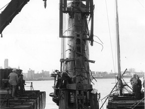 After a ducking in the Detroit River and heavy work by cranes and diving equipment, a railway tank car was brought from the water  and yard operations were restored to normal. The tank car slipped off the car ferry in 1958. (FILES/The Windsor Star)