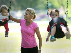 Pam Rodzik enjoyed the fantastic sunny weather Wednesday, May 15, 2013, at the Kiwanis Park in Windsor, Ont. with her grandchildren Rowan Voy, 4, and Sophie Voy 1.   (DAN JANISSE/The Windsor Star)