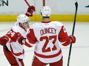 Detroit's Damien Brunner, left, celebrates his goal with Kyle Quincey against the Anaheim Ducks during the first period in Game 2 of their Western Conference quarter-final in Anaheim, Calif., Thursday, May 2, 2013. (AP Photo/Chris Carlson)