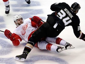 Detroit's Carlo Colaiacovo, left, and Anaheim's Daniel Winnik collide during Game 7 of their NHL Western quarter-final in Anaheim, Calif., Sunday, May 12, 2013. (AP Photo/Chris Carlson)