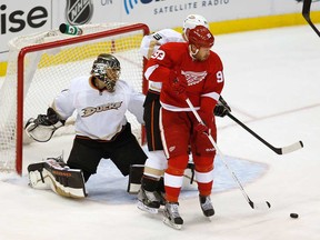 Detroit's Johan Franzen, right, tries to re-direct a first-period shot in front of Anaheim goalie Jonas Hiller during Game 6 of the Western Conference Quarter-finals during the 2013 NHL Stanley Cup Playoffs at Joe Louis Arena May 10, 2013 in Detroit. (Gregory Shamus/Getty Images)