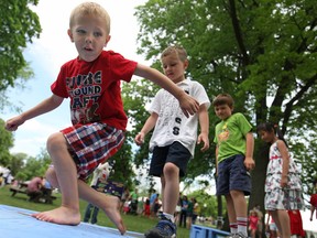 Travis Jankovich, 4, left, plays in the Kid's Zone at the 35th annual Art in the Park at Willistead Park, Saturday, June 1, 2013.  (DAX MELMER/The Windsor Star)
