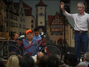 Richard Lavin auctions off a bicycle at the Windsor Police Service auction at the Teutonia Club, Saturday, June 15, 2013.  (DAX MELMER/The Windsor Star)