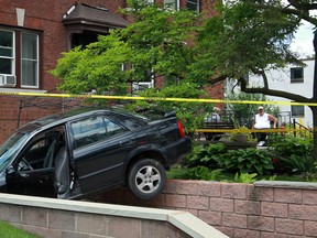 Windsor police investigate a single-vehicle accident at the intersection of Elliott Street and Victoria Avenue, where to two pedestrians were struck, Sunday, June 16, 2013.  The victims were transported to hospital with serious, but non-life threatening injuries.  (DAX MELMER/The Windsor Star)