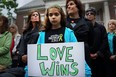 Cecilia Floros, 10, of Newtown attends a remembrance event on the six-month anniversary of the massacre at Sandy Hook Elementary School on June 14, 2013 in Newtown, Conn. A a 26-second moment of silence was observed to honor the 20 children and six adults who were killed at the school on Dec. 14. The event also included the reading of the names of over 6,000 people who have been killed by gun violence since the massacre in Newtown. (Photo by Spencer Platt/Getty Images)