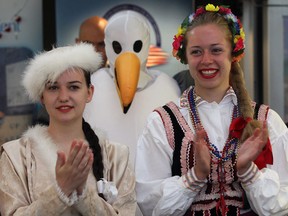 Emily Lemmon, left, and Julia Kulesza of Windsor's Polish Community along with Amherstburg's Department of Recreation and Culture bird mascot, centre, were part of the recent Tourism Week Kick Off event. Amherstburg has two new giant seagull mascots to keep things lighthearted at local festivals. (NICK BRANCACCIO/The Windsor Star)