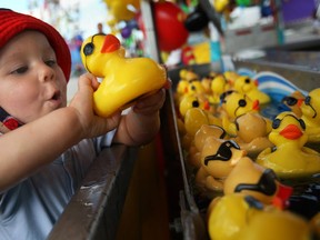 Parker Rioux, 1, has a blast plucking rubber ducks from the duck pond at the 2013 Windsor Summerfest, at the Riverfront Festival Plaza, Sunday, June 16, 2013.  (DAX MELMER/The Windsor Star)