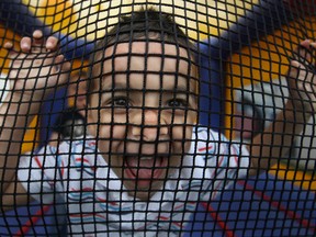 Jack Leis, 4, plays with the netting inside a bouncy castle at the tenth annual Carstar Collision Car Wash, Saturday, June 8, 2013. The fundraiser benefits both Cystic Fibrosis Canada and the Special Stars Windsor Essex County soccer league.  (DAX MELMER/The Windsor Star)