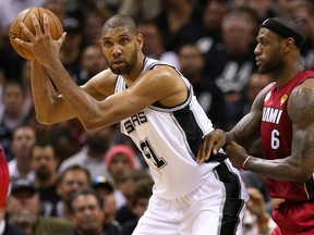 San Antonio's Tim Duncan, left, is guarded by Miami's LeBron James in Game 3 of the 2013 NBA Finals at the AT&T Center in San Antonio, (Photo by Mike Ehrmann/Getty Images)