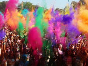 Finishers take part in a mass colour throw after completing the Colour Run on February 10, 2013 in Sydney, Australia.  (Mark Kolbe/Getty Images)