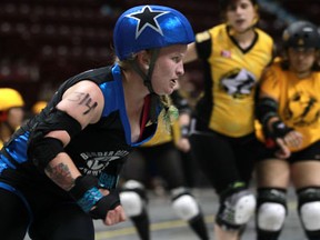 The Border City Brawlers, left, battle the G-Stars from Toronto at the Roller Derby Association of Canada Eastern Regionals at the WFCU Centre Saturday. (DAX MELMER/The Windsor Star)