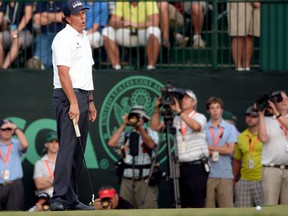 Phil Mickelson reacts after making a putt for bogey on the 18th hole Saturday at the 113th U.S. Open at Merion Golf Club in Ardmore, Pennsylvania. (Photo by Ross Kinnaird/Getty Images)