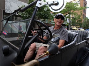 Wayne Dumaine drives his 1924 Model T Touring American Sedan in downtown Windsor June 13, 2013. Dumaine's '24 Model T was found in shipping crates and restored.  About 90 years ago,  the Model T was shipped new from Jacksonville, Florida and it spent time in Uruguay and Agrentina before being spotted and shipped back the North America.  (NICK BRANCACCIO/The Windsor Star)