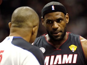 Miami's LeBron James, right, argues a call with referee referee Tony Brothers in the first quarter while taking on the San Antonio Spurs during Game 5 of the NBA Finals at the AT&T Center Sunday  in San Antonio. (Photo by Kevin C. Cox/Getty Images)