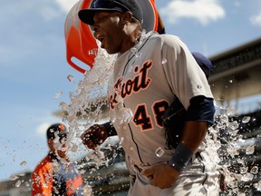 Detroit's Prince Fielder pours ice water on teammate Torii Hunter after a win against the Minnesota Twins Sunday at Target Field in Minneapolis. (Photo by Hannah Foslien/Getty Images)