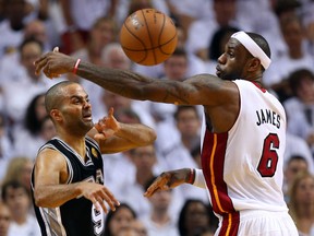 San Antonio's Tony Parker, left, passes the ball against Miami's LeBron James in the second half during Game 6 of the NBA Finals. (Photo by Mike Ehrmann/Getty Images)