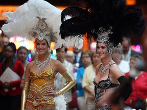 Nadia Hamdon, left, and Emma Truswell of Caesars Windsor help casino patrons and visitors celebrate 5th anniversary of Caesars Windsor brand, Tuesday June 11, 2013. (NICK BRANCACCIO/The Windsor Star)