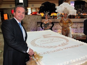 Caesars Windsor CEO Kevin Laforet, left, and Mayor Eddie Francis were joined by Emma Truswell, behind left, and Nadia Hamdon during 5th anniversary event for Caesars Windsor, Tuesday June 11, 2013. Caesars Windsor donated $25,000 to area charities to mark their milestone and offered cupcakes for casino visitors. (NICK BRANCACCIO/The Windsor Star)