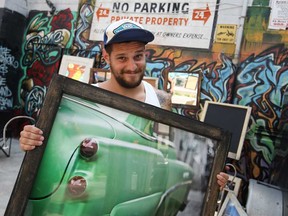 Mike Difazio, from Trashouse, holds a piece he's selling at the Alley Art Show and Sale in Maiden Lane in downtown Windsor, Sunday, June 23, 2013.  (DAX MELMER/The Windsor Star)