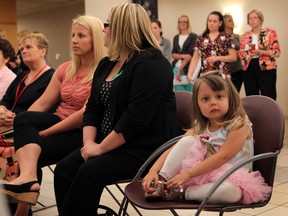 Emily LeDoux quietly sits in the front row beside Chantelle Foreman-Meadows and Windsor Police Constable Lindsay Fleming, left, at Windsor Regional Hospital's organ and tissue donation awarenss event Tuesday June 11, 2013. A donation by Windsor Police Services was made to Windsor Regional Hospital to fund organ donor brochures. (NICK BRANCACCIO/The Windsor Star)