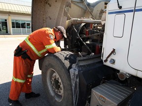 MTO officer Matt Kempster inspects the front end of a dump truck during a LaSalle police joint operation on Malden Road Wednesday, June 19, 2013. (NICK BRANCACCIO/The Windsor Star)