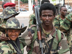 In this March 27, 2013 photo, young soldiers from the Seleka rebel alliance pose for a photo as they stand amidst their fellow soldiers at the Ledger Plaza Bangui hotel, in Bangui, Central African Republic. (Associated Press photo)