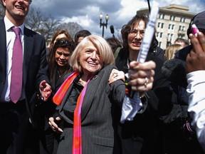 In this file photo, Edith Windsor (C), 83, is mobbed by journalists and supporters as she leaves the Supreme Court March 27, 2013 in Washington, DC. (Chip Somodevilla/Getty Images)