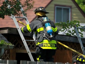 Windsor firefighters deal with a garage fire at 1228 California Ave., Sunday, June 23, 2013.  No injuries were reported.  (DAX MELMER/The Windsor Star)