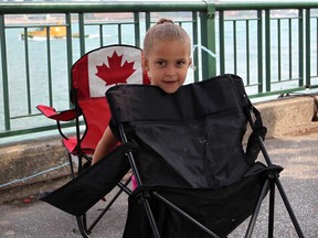 Alaysia Elam, 4, joined by her family get ready bright and early at Dieppe Gardens in Windsor, Ont., as crews and visitors prepare for the annual Ford Fireworks presented by Target Monday June 24, 2013.  (NICK BRANCACCIO/The Windsor Star)