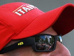 A large crowd of fans is reflected in the sunglasses of Indy 500 winner, Tony Kanaan, at the Chevrolet Detroit Belle Isle Grand Prix, Sunday, June 2, 2013.  (DAX MELMER/The Windsor Star)