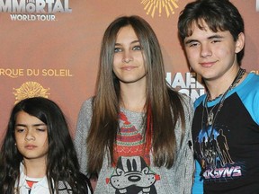 The Jackson children, Prince Michael (Blanket) Jackson, left, Paris Jackson and Prince Jackson. Paris Jackson is physically fine after being taken to a hospital early Wednesday, June 5, 2013, an attorney for Jackson's mother said. Perry Sanders Jr. writes in a statement that Paris Jackson is getting appropriate medical attention and the family is seeking privacy. Fire and sheriff's officials confirmed they transported someone from a home in Paris' suburban Calabasas neighbourhood for a possible overdose but did not release any identifying information or additional details. (VALERIE MACON , AFP/Getty Images)