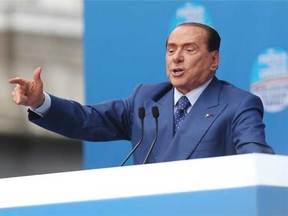 Silvio Berlusconi convicted in sex-for-hire trial; sentenced to 7 years and barred from office. 
(Antonio Calanni , AP)