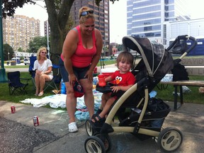 Cindy Kehoe, LeAnn Kehoe and David Kehoe, just 16 months, stake out their turf for the Target Fireworks show on June 24, 2013. (TwitPic: Jason Kryk/The Windsor Star)