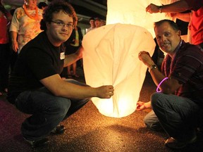 Files: Matthew Lemmon, left, and his dad Roger prepare to release a Chinese floating fire lantern in the parking lot of Dairy Freez in North Ridge on Saturday, June 22, 2013. (REBECCA WRIGHT/ The Windsor Star)