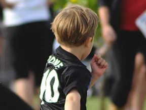 A child runs at Riverside Sportsmen's Club in Windsor, Ont., prior to the Moon in June run Saturday, June 8, 2013. (Rob Benneian/Special to The Star)