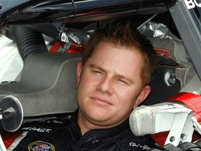 In this July 6, 2007 file photo, NASCAR Busch series driver Jason Leffler sits in his car before his qualifying run at the Daytona International Speedway in Daytona Beach, Fla. Leffler died after an accident in a heat race at a dirt car event at Bridgeport Speedway in Swedesboro, N.J., Wednesday night, June 12, 2013, New Jersey State Police said. (AP Photo/Glenn Smith, File)