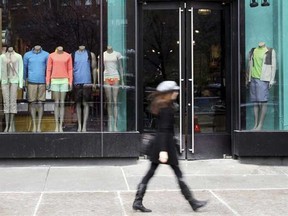 A woman walks past the Lululemon Athletica store at Union Square in New York. Lululemon is starting to get its Luon black yoga pants, which were pulled in March for being too sheer, back into its stores. That bodes well for the company, analysts said Monday, June 3, 2013. (AP Photo/Mary Altaffer)