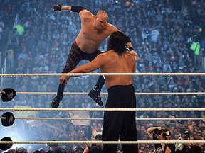 WWE wrestler Kane leaps from the top rope against Khali at Wrestlemania in Detroit in this April 2007 file photo. (Jason Kryk / The Windsor Star)