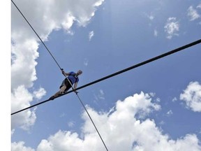 High wire performer Nik Wallenda walks across a wire as he practises Tuesday, June 18, 2013 in Sarasota, Fla. Wallenda, a seventh generation high-wire walker, will attempt to walk across the Grand Canyon on Sunday, June 23, 2013. (Chris O'Meara, The Canadian Press)