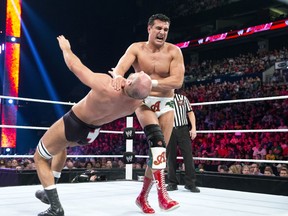 WWE Superstar Alberto Del Rio clotheslines WWE Superstar Antonio Cesaro on April 29, 2013. (Handout Photo: WWE)