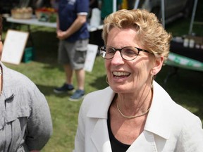 In this file photo, Ontario Premier, Kathleen Wynne, right, is joined by Windsor West MPP Teresa Piruzza at the Riverside Farmer's Market at the Riverside Sportsmen's Club, Sunday, June 2, 2013.  Wynne appointed Piruzza Minister Responsible For Women’s Issues to replace Laurel Broten who held the position. (DAX MELMER/The Windsor Star)