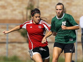 Belle River's Madison Dalley, right, is chased by Sarnia Northern's Teaghan Gagne at the McHugh Soccer Complex in Windsor. (TYLER BROWNBRIDGE/The Windsor Star)