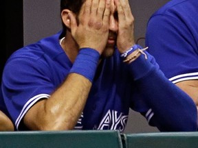Toronto catcher J.P. Arencibia covers his face during the eighth inning of their 4-1 loss to the Tampa Bay Rays Monday in St. Petersburg, Fla. (AP Photo/Chris O'Meara)