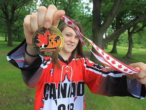 Gwynne Attenborough displays her gold medal from the Women's World Ball Hockey Championship. (JASON KRYK/The Windsor Star)