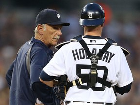 Tigers manager Jim Leyland, right, talks with catcher Bryan Holaday during a pitching change in the fifth inning against the Los Angeles Angels at Comerica Park Tuesday. (Photo by Leon Halip/Getty Images)