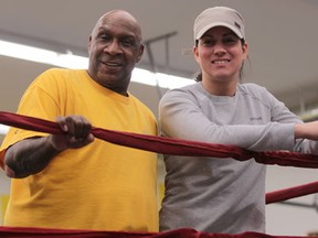 Olympic boxer Mary Spencer, right, takes a break with trainer Charlie Stewart in 2012. (JASON KRYK/The Windsor Star)