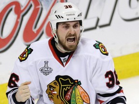 Chicago's Dave Bolland celebrates his game-winning goal against the Boston Bruins during the third period in Game 6 of the Stanley Cup final June 24 in Boston. (AP Photo/Charles Krupa)