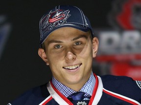 Spits forward Kerby Rychel poses with his jersey after being selected number 19 overall in the first round by the Columbus Blue Jackets during the 2013 NHL Draft at the Prudential Center Sunday in Newark, New Jersey.  (Photo by Bruce Bennett/Getty Images)